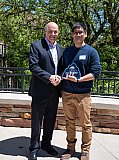 CIRES Director Waleed Abdalati poses with award recipient Chia-Wei Hsu at Rendezvous 2024. - Rendezvous 2024