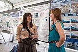 Sarah Child and Naomi Ochwat chat during the Rendezvous 2024 poster session. - Rendezvous 2024