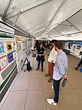 Tectonic geodesist Kathryn Materna vists with guests at the poster session during Rendezvous 2024 - Rendezvous 2024