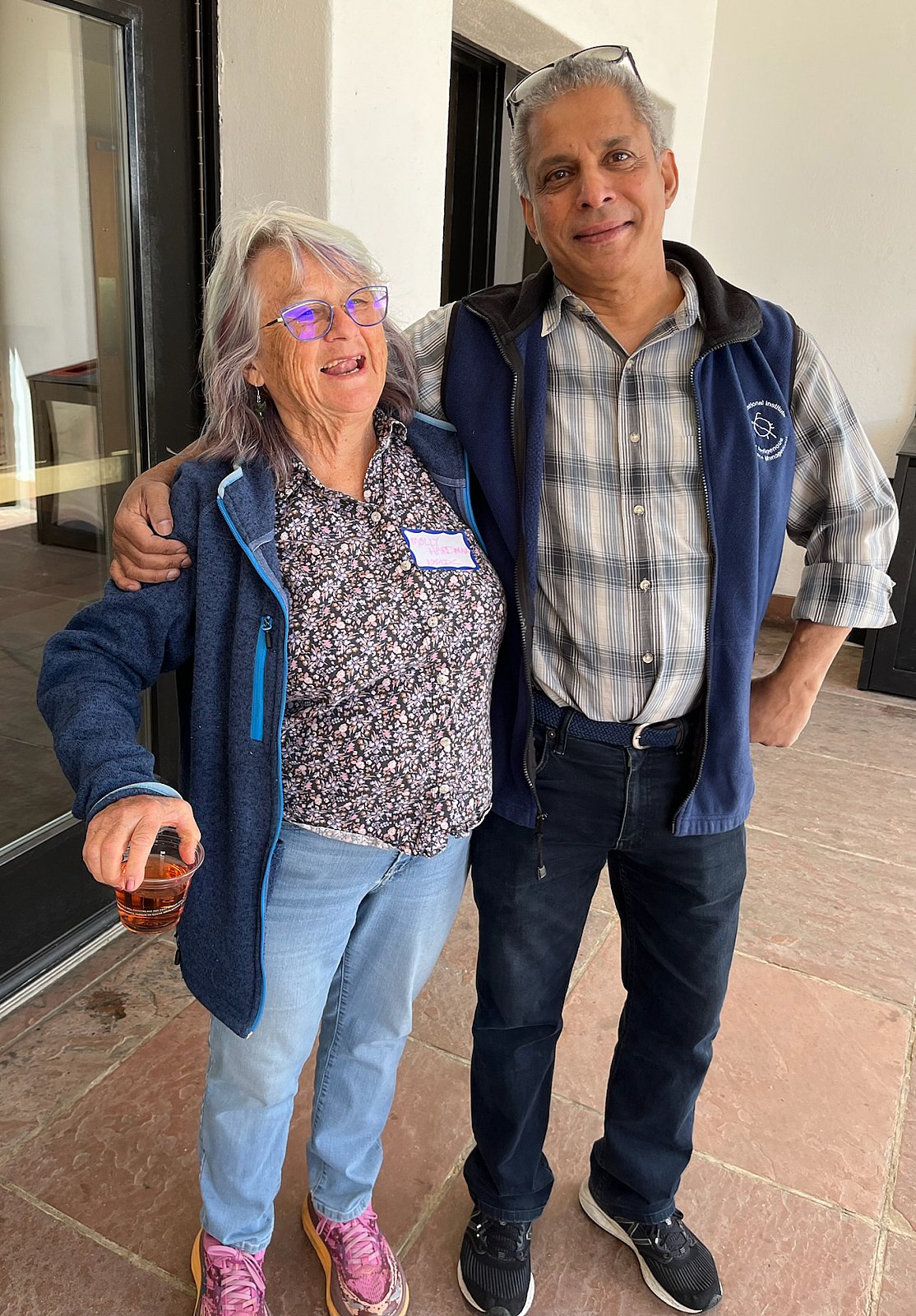 CIRES software developer and engineer Molly hardman poses with  Senior Scientist and Acting Director of NOAA PSL Roger Pulwarty at CIRES Rendezvous 2025. - Rendezvous 2025