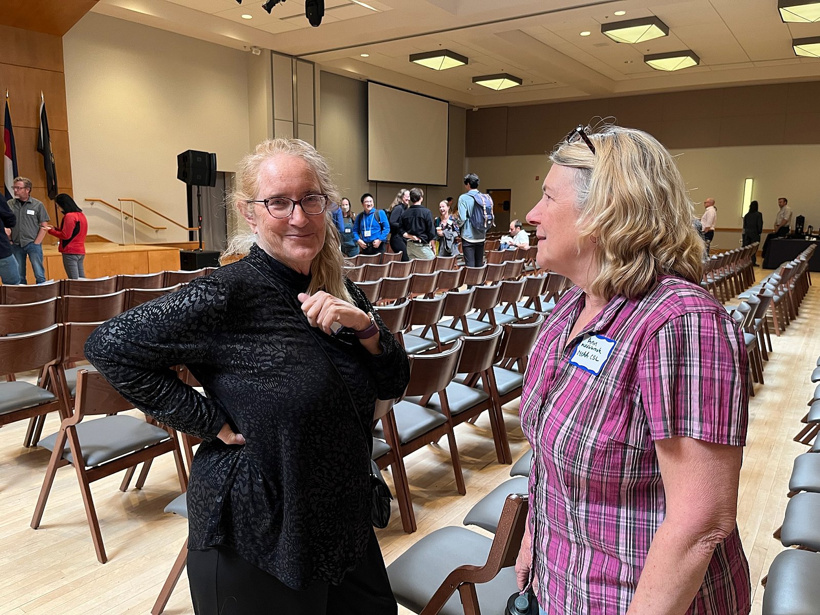 Distinguished Professor of Chemistry, and CIRES Associate Director Maggie Tolbert visits with  NOAA CSL Research Chemist Ann Middlebrook at CIRES Rendezvous 2025. - Rendezvous 2025