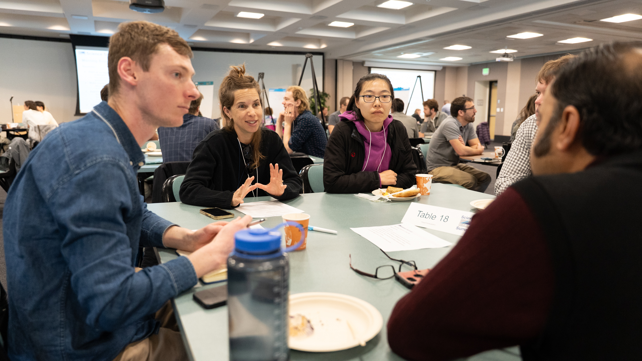 CIRES Science Summit 2025 Participants - 4 Researchers Discussing Topics Fall 2025 Participants - 4 Researchers